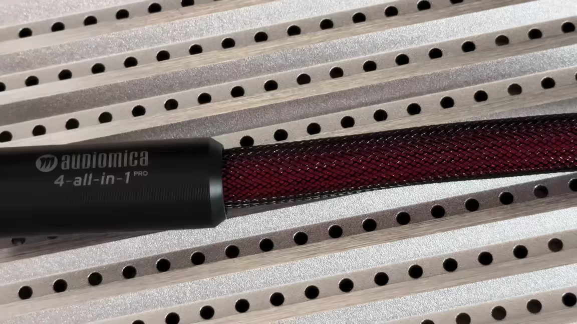 The PRO speaker cable's mesh-braided run leading into its black metal '4-all-in-1' splitter