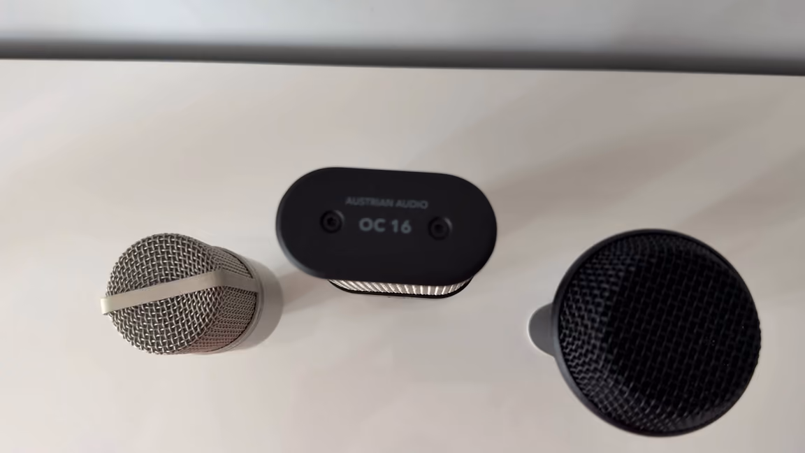The OC16's flat oval top plate seen from above, set between two round-headed microphones
