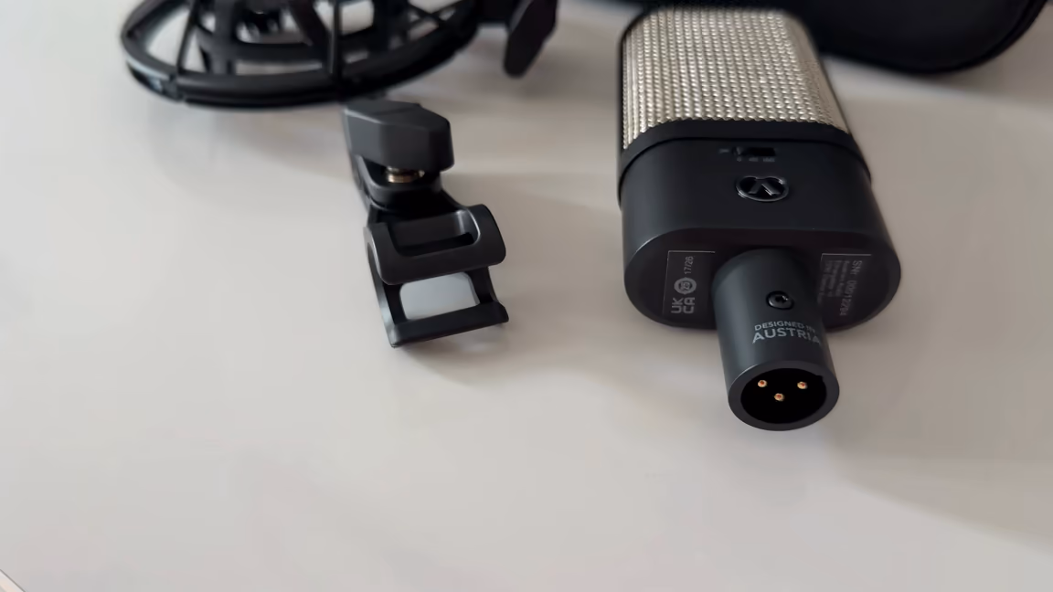 Three-pin XLR output on the OC16's base, marked Designed in Austria, next to the small clip mount