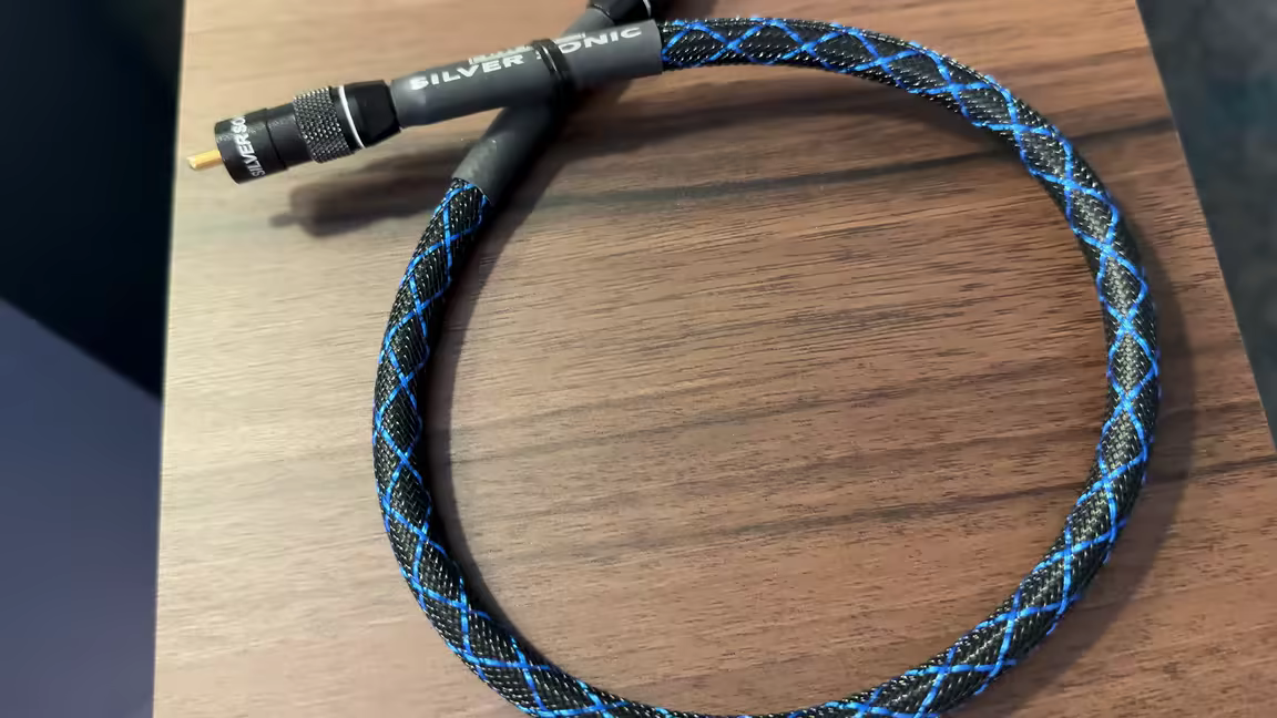 A DH Labs Silver Sonic cable with its blue-and-black braided jacket and machined metal connectors