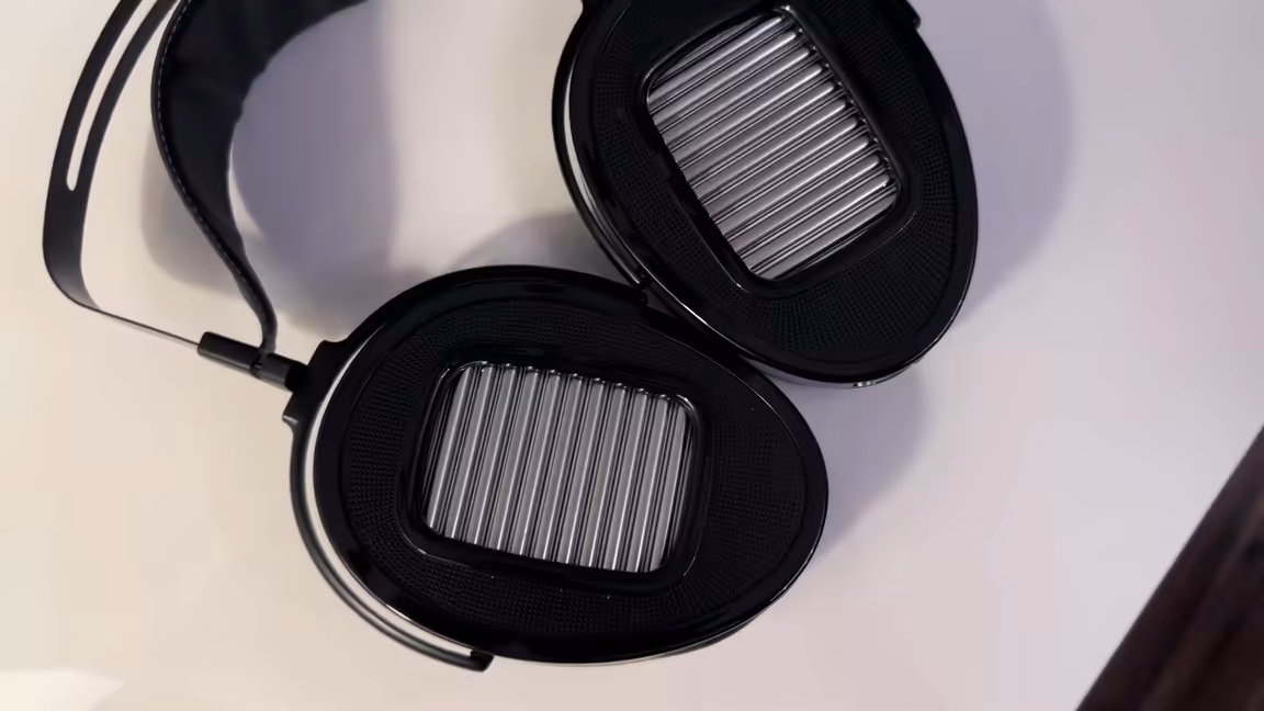 Top-down view of the Arya Unveiled's asymmetrical hybrid ear pads, the exposed drivers visible through the openings