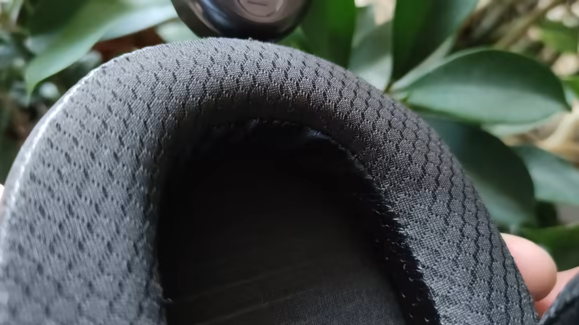 Close-up of the Edition XS's large, deep oval ear pad and its breathable fabric face