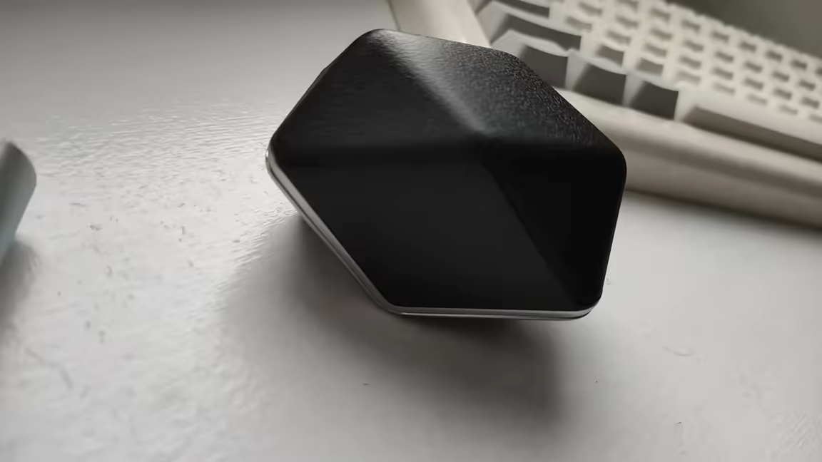 The HIFIMAN Svanar Wireless's bulky, diamond-shaped charging case