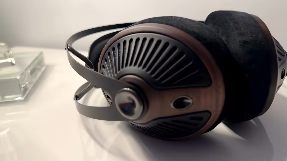 The Meze 105 Silva's hand-polished walnut earcup with its intricate radial grille and velour pad