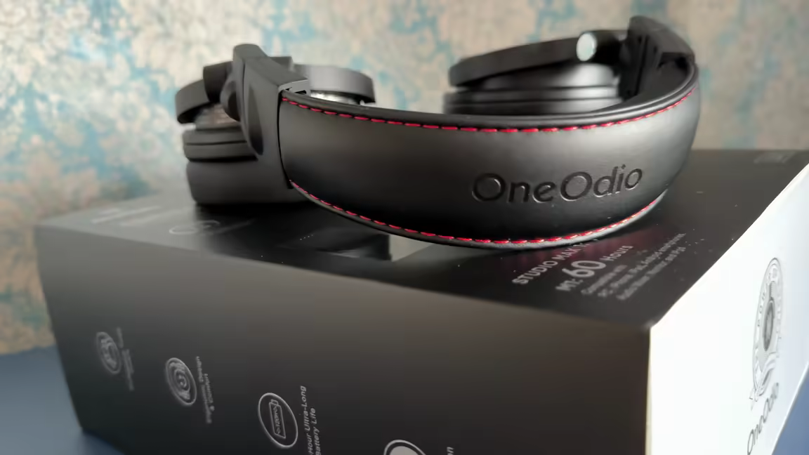 The OneOdio Max 1's leatherette headband with red contrast stitching and embossed logo