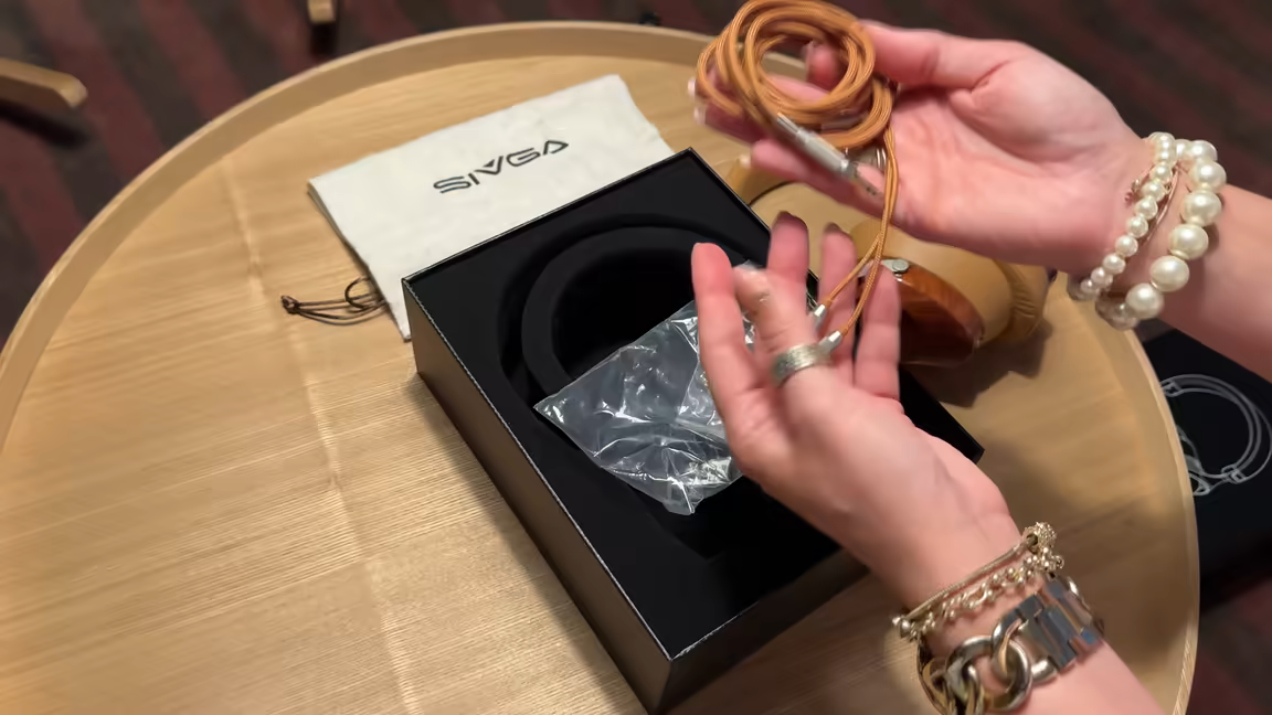 The Sivga Robin's color-matched braided cable coiled up, showing its metal 2.5mm connectors