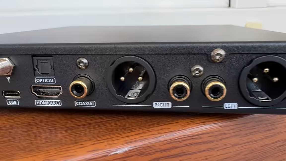 The SMSL DL100's rear panel: USB-C, HDMI ARC, optical, coaxial and Bluetooth-antenna inputs beside balanced XLR and single-ended RCA outputs