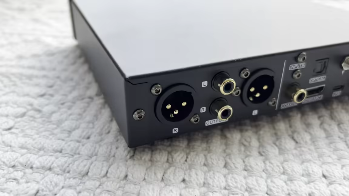 The SMSL DO100 PRO's rear panel with balanced XLR and RCA outputs plus USB, optical, coax, and HDMI ARC inputs