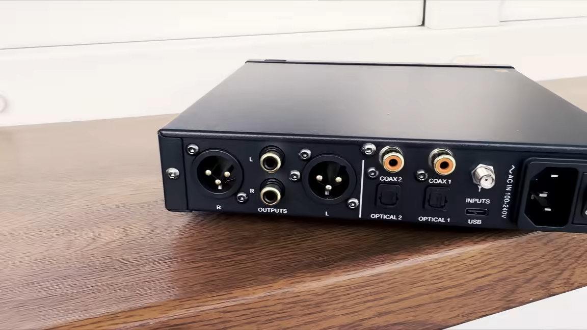 The SMSL RAW-MDA1's rear panel: balanced XLR and single-ended RCA line outputs beside dual coaxial and optical inputs, a USB-C input, and the IEC power inlet