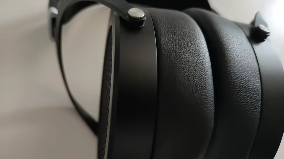 Side view of the HIFIMAN Sundara's protein-leather ear pads, suspension strap, and metal gimbal screws