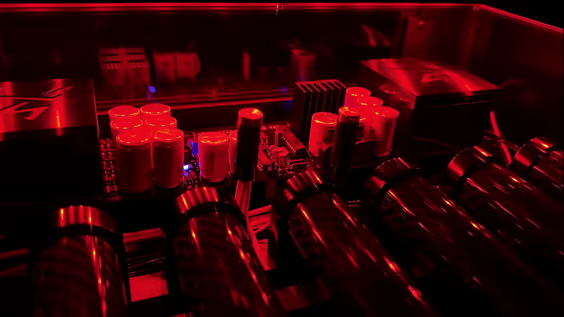The PowerCell 14's internals lit deep red by its color-selectable lighting, seen through the plexiglass top