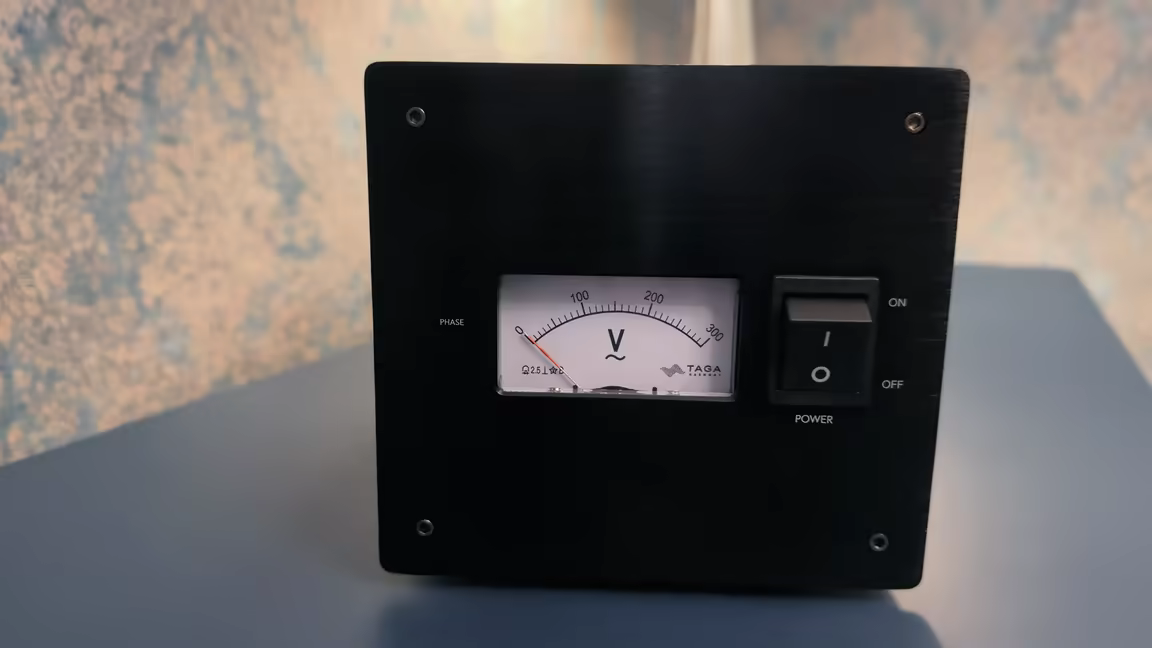 The PF-1000LPS's black front panel with its VU-style voltage meter and the power on/off rocker switch