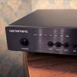 The Denafrips Enyo 15th's front panel with its metal buttons and red sample-rate and input LEDs