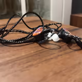 The KBEAR KB02's detachable braided 2-pin cable, gold 3.5mm plug, and silicone tips