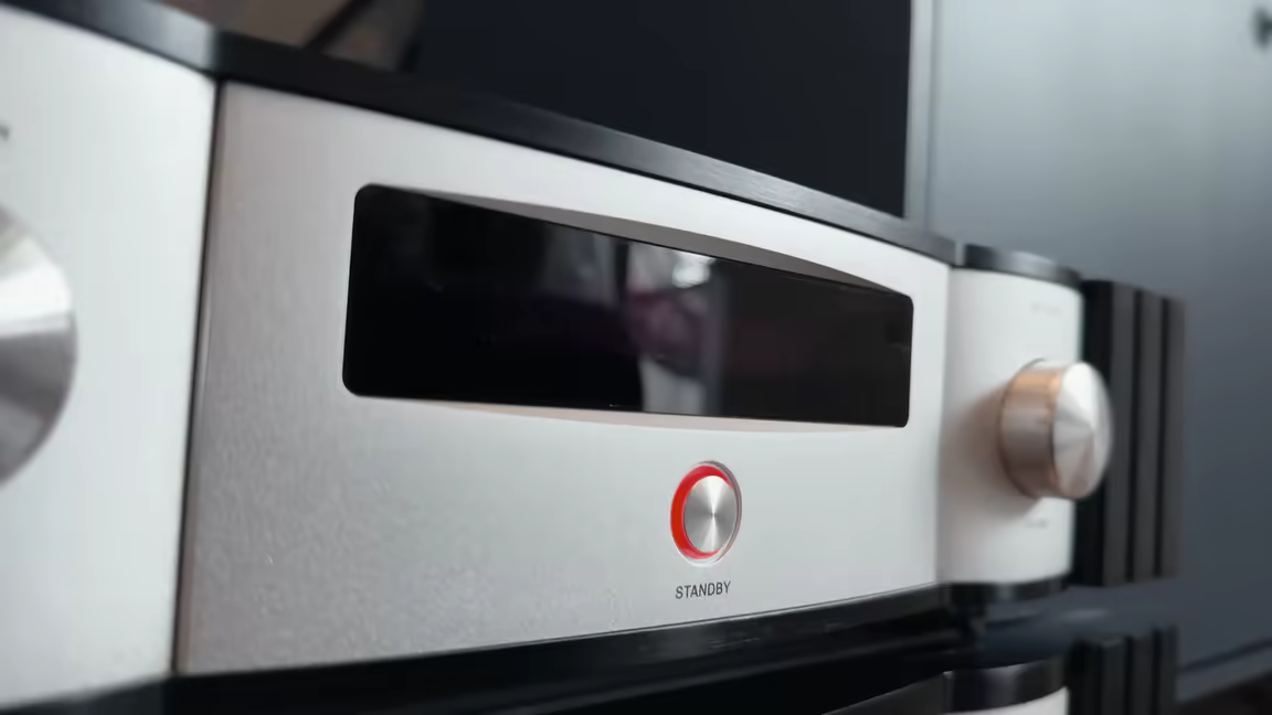 The AD-1PA+'s brushed-aluminium front panel with its red-lit standby button ringed by an LED status indicator