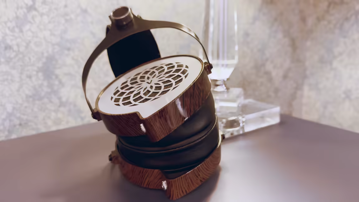 The Verum 1's wood-finish comma-shaped earcup, metal cut-out grill, and suspension headband